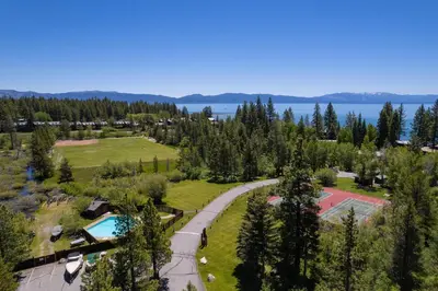 an aerial view of a park with a pool and a tennis court at Star Harbor # 8 By Hauserman Rentals in Tahoe City