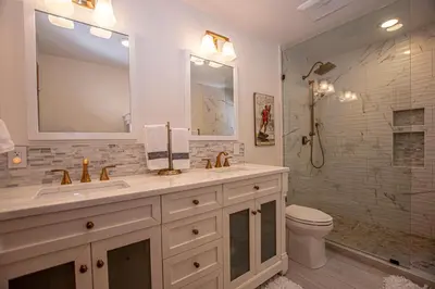 a bathroom with a sink and a toilet and a shower at Thunder Lodge By Hauserman Rentals in Homewood