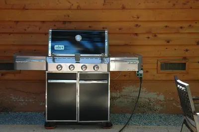 a stainless steel stove in front of a wooden wall at Willow By Hauserman Rentals in Tahoe City