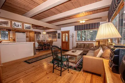 a living room with a couch and a table at Willow By Hauserman Rentals in Tahoe City