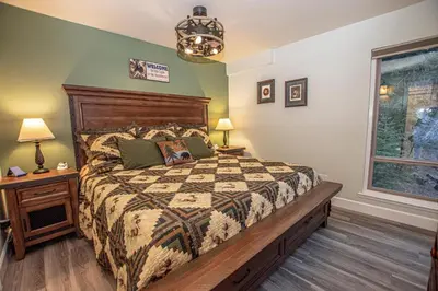 a bedroom with a bed and a window at Weathertop By Hauserman Rentals in Tahoe City
