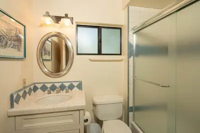 a bathroom with a toilet and a sink and a mirror at Star Harbor # 6 By Hauserman Rentals in Tahoe City
