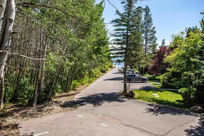 a street with trees on both sides of the road at St Francis #18 By Hauserman Rentals in Tahoe City