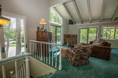 a living room with a couch and a chair at St Francis #18 By Hauserman Rentals in Tahoe City