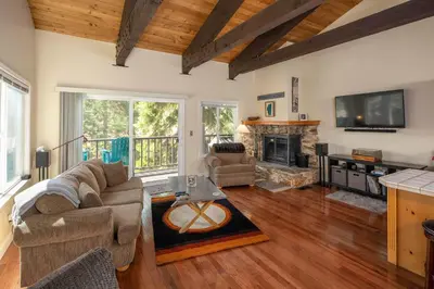 a living room with a couch and a fireplace at Dollar Hill II # 25 By Hauserman Rentals in Tahoe City