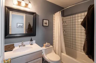 a bathroom with a sink and a toilet and a mirror at Dollar Hill II # 25 By Hauserman Rentals in Tahoe City