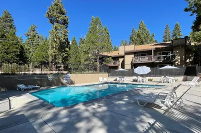 a swimming pool in front of a house at Dollar Hill II # 25 By Hauserman Rentals in Tahoe City