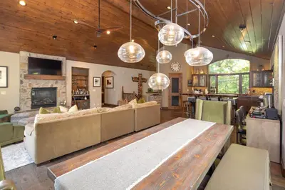 a living room with a couch and a table at Aspen Grove By Hauserman Rentals in Tahoe City
