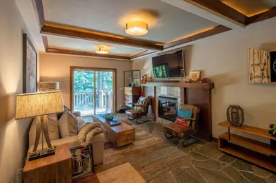 a living room with a couch and a fireplace at Aspen Grove By Hauserman Rentals in Tahoe City