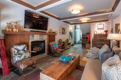a living room with a couch and a fireplace at Aspen Grove By Hauserman Rentals in Tahoe City