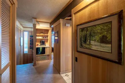 a hallway with a large painting on the wall at Rocky Ridge # 04 By Hauserman Rentals in Tahoe City