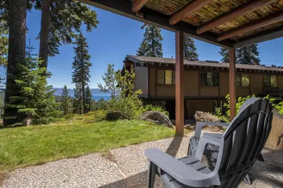 two chairs sitting on a patio in front of a house at Rocky Ridge # 04 By Hauserman Rentals in Tahoe City