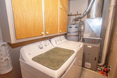 a kitchen with a washing machine in a room at Knobcone Cabin by Hauserman Rental Group in Tahoma