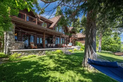 a hammock in front of a house at Peaceful Waters By Hauserman Rentals in Tahoma