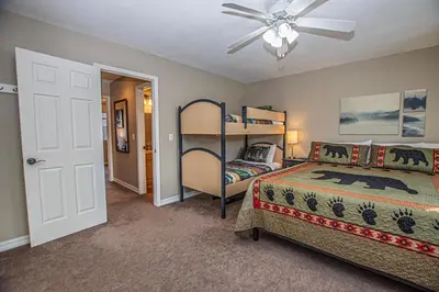 a bedroom with a bed and a ceiling fan at Lake Forest Glen # 117 By Hauserman Rentals in Tahoe City