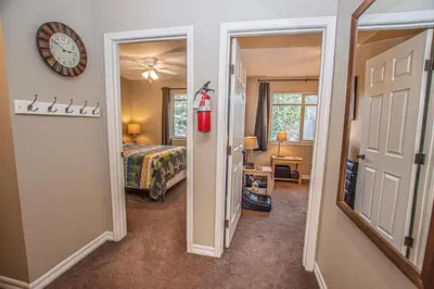 a bedroom with a bed and a clock on the wall at Lake Forest Glen # 117 By Hauserman Rentals in Tahoe City