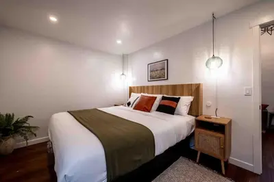 a bedroom with a large bed in a room at Columbia Cabins Cabin 1 in Sonora