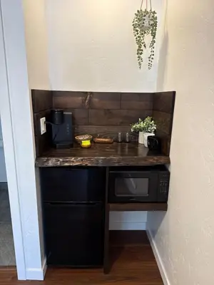 a kitchen with a counter and a microwave at Columbia Cabins Cabin 6 in Sonora
