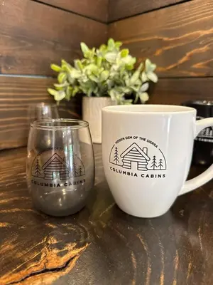 a cup and a coffee mug and a glass at Columbia Cabins Cabin 6 in Sonora