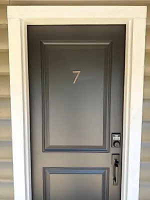 a door with a number seventy seven on it at Columbia Cabins Cabin 7 in Sonora