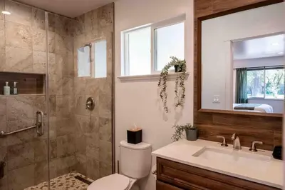 a bathroom with a toilet and a shower and a sink at Columbia Cabins Cabin 8 in Sonora