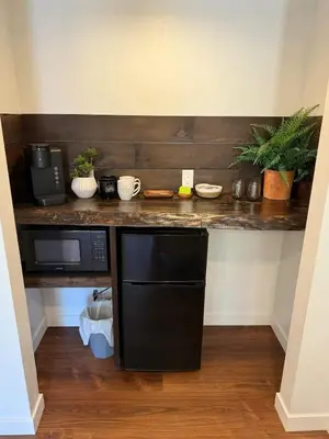 a kitchen with a counter top with a microwave and a microwave at Columbia Cabins Cabin 8 in Sonora