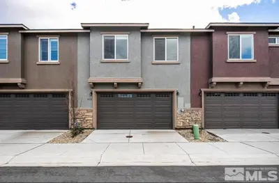 a house with two garages and two garage doors at Local 3BD 3BA with WiFi Parking in Carson City