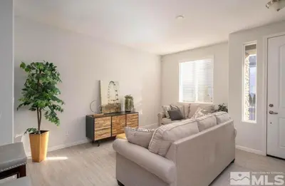a living room with a couch and a table at Local 3BD 3BA with WiFi Parking in Carson City