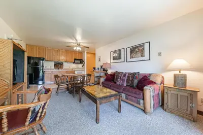 a living room with a couch and a table at Spacious 1BR Condo #218 at Donner Lake Village in Truckee