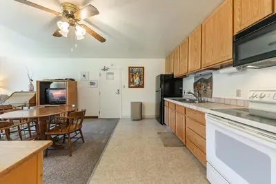 a kitchen with a table and a dining room at Spacious 1BR Condo #218 at Donner Lake Village in Truckee