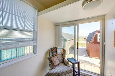a living room with a chair and a window at 11 Mi to Heavenly Resort Pet-Friendly Tiny Home in Gardnerville