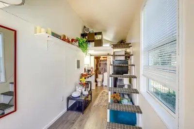 a room with a spiral staircase and a window at 11 Mi to Heavenly Resort Pet-Friendly Tiny Home in Gardnerville