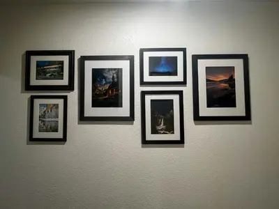 a group of framed pictures on a wall at Yosemite Family Lodge I Sleeps 11 I Game Room in Oakhurst