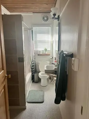 a small bathroom with a toilet and a sink at Sam's Place Mariposa - In Town! in Mariposa