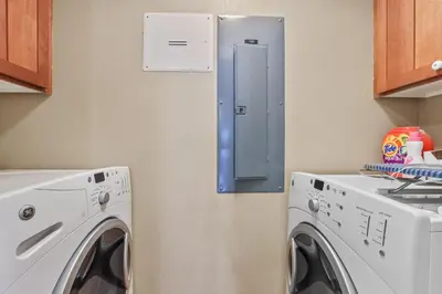 a small laundry room with a washer and dryer at Spacious Elegance-Kirkwood-Timber Ridge 3 Bedroom residence in Kirkwood