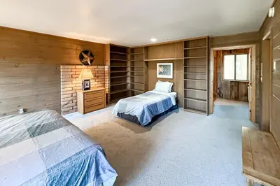 a bedroom with wooden walls and a bed in a room at Vernal Vista in Yosemite West