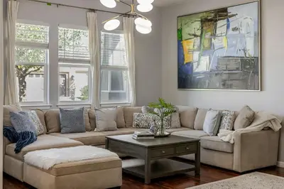 a living room with a couch and a coffee table at New Reno Retreat 72 Inch TV Office Patio Views in Reno