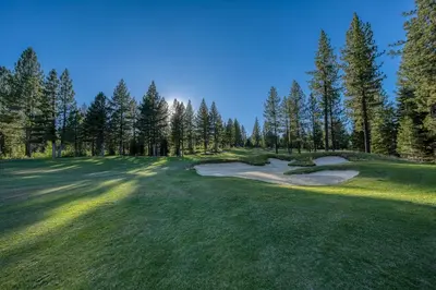 a view of a golf course with trees and a green at Schaffers Mill Escape Golf Views and Near Skiing in Truckee