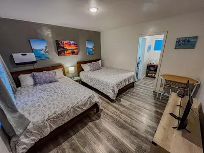 a hotel room with two beds and a table at The Chalet at Kings Beach Unit 4 in Kings Beach