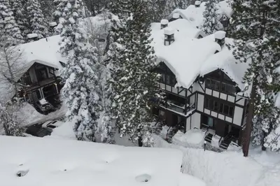an aerial view of a house covered in snow at Tavern 16 in Olympic Valley