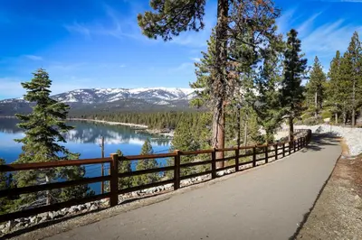 a path with a view of a lake and mountains at Sierra Townhome in Incline Village