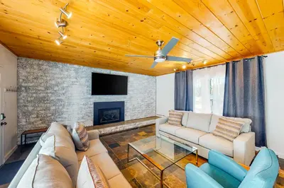 a living room with a couch and a fireplace at The Chalet at Kings Beach Unit 8 in Kings Beach