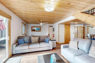 a living room with two couches and a table at Lake Forest Manor in Tahoe City