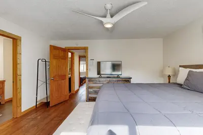 a bedroom with a bed and a ceiling fan at Lake Forest Manor in Tahoe City