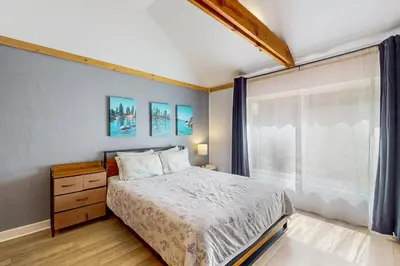 a bedroom with a bed and a window at The Chalet at Kings Beach Unit 7 in Kings Beach