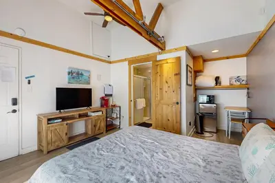 a bedroom with a bed and a flat screen tv at The Chalet at Kings Beach Unit 7 in Kings Beach