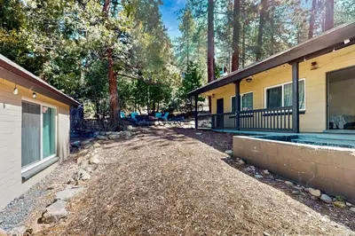 an empty driveway next to a house with trees at The Chalet at Kings Beach Unit 7 in Kings Beach
