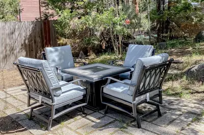 three chairs and a table in a yard at The Chalet at Kings Beach Unit 5 in Kings Beach