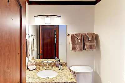 a bathroom with a toilet and a sink and a mirror at Lake Tahoe Oasis in Kings Beach