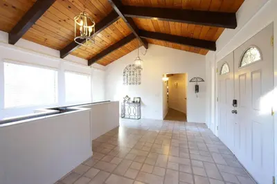 a large hallway with white walls and a wooden ceiling at Spacious 3BR Retreat - Sleeps 10 - Free Parking in Camino